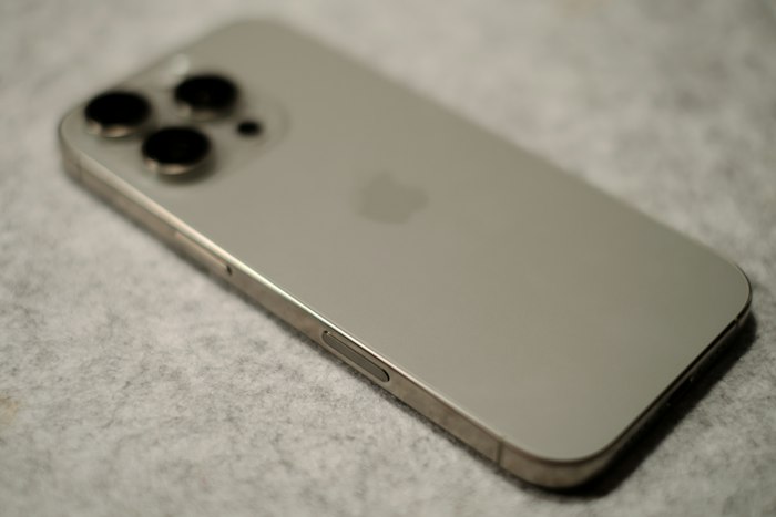 Titanium smartphone on a light surface